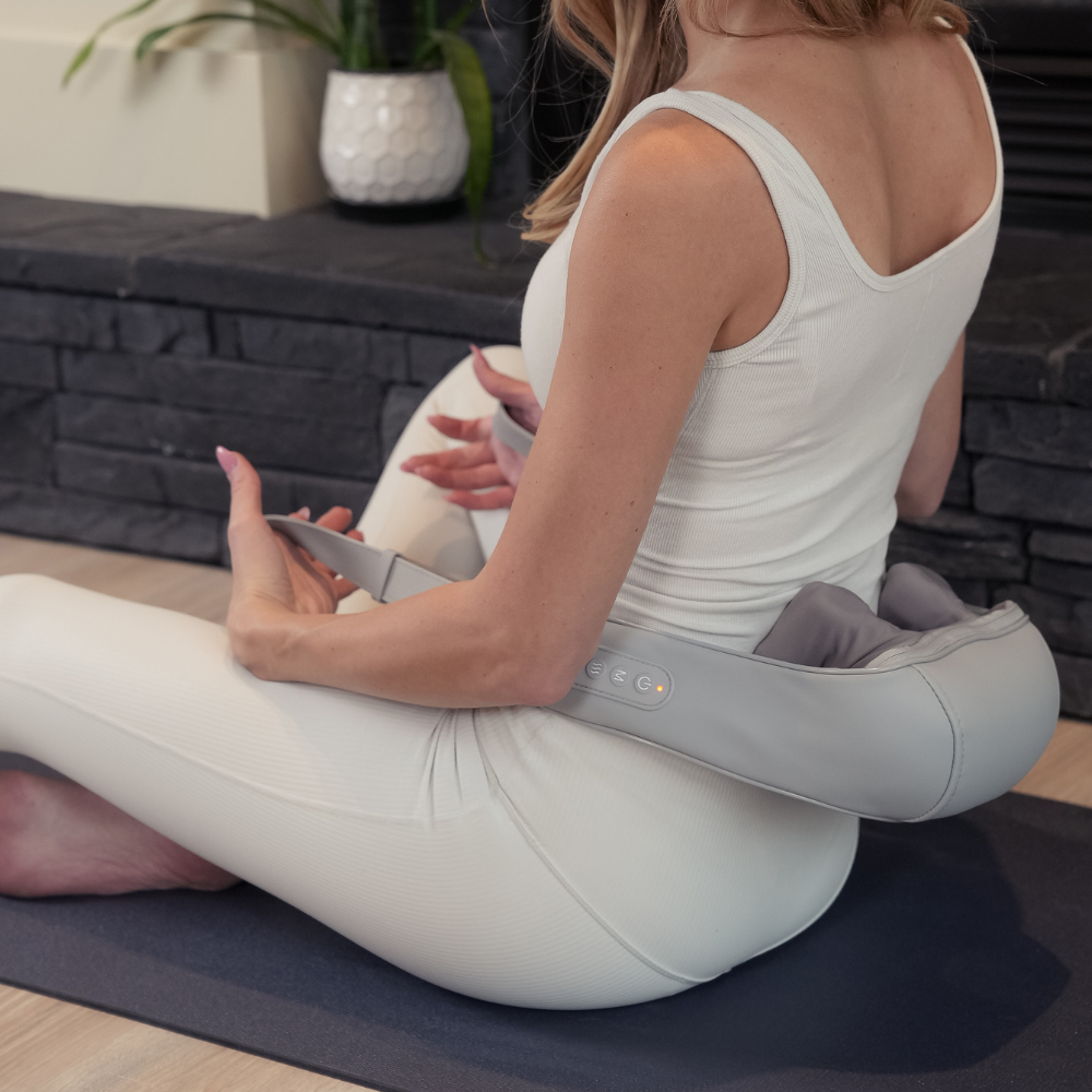 Woman using the Backplus® Cordless Platinum Shiatsu Massager on her lower back