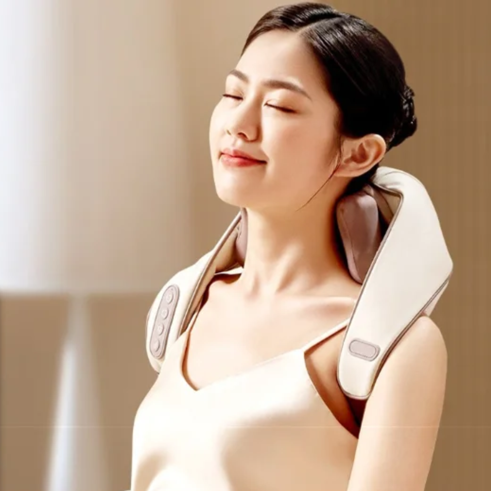 Woman looking relaxed while using the Backplus® Cordless Platinum Shiatsu Massager