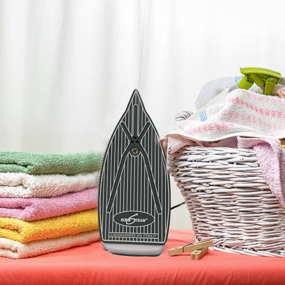 Eurosteam® Platinum Iron sole plate view with laundry in the background