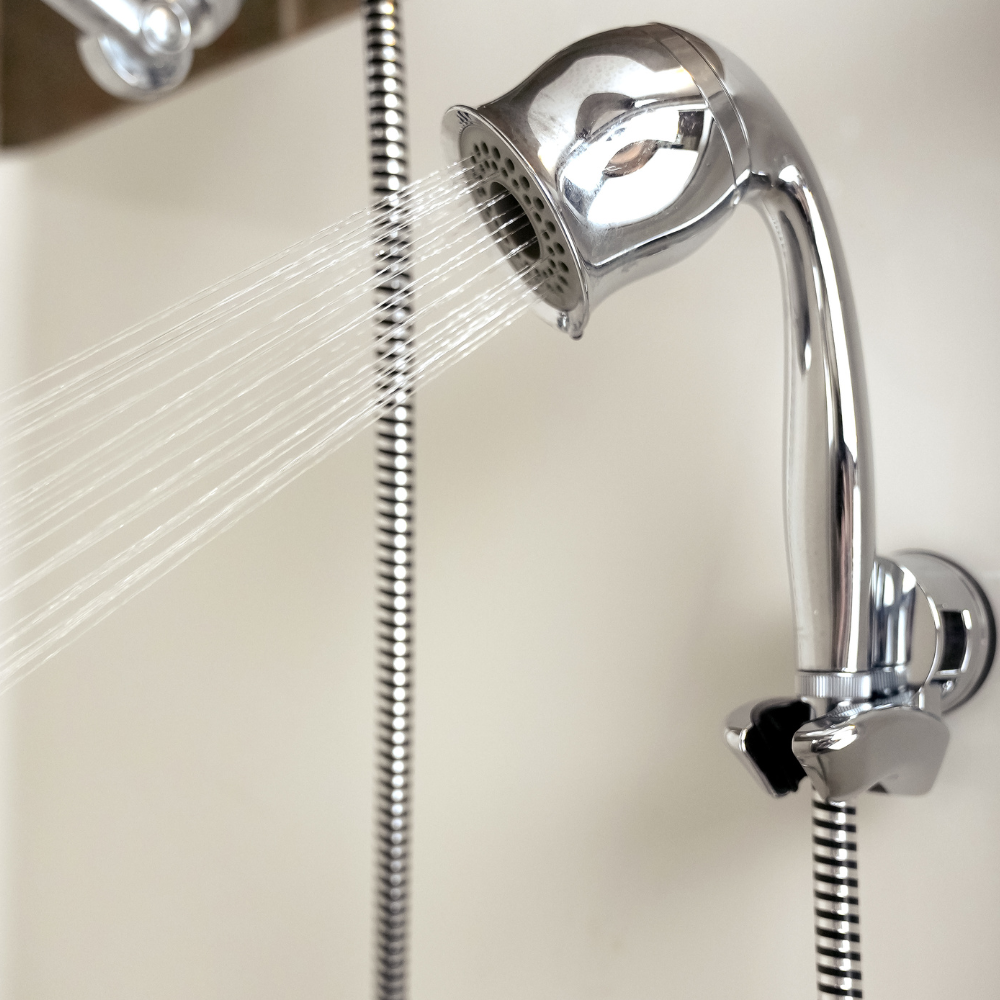 ShowerMe® Handheld Shower Head Chrome mounted in shower with water running