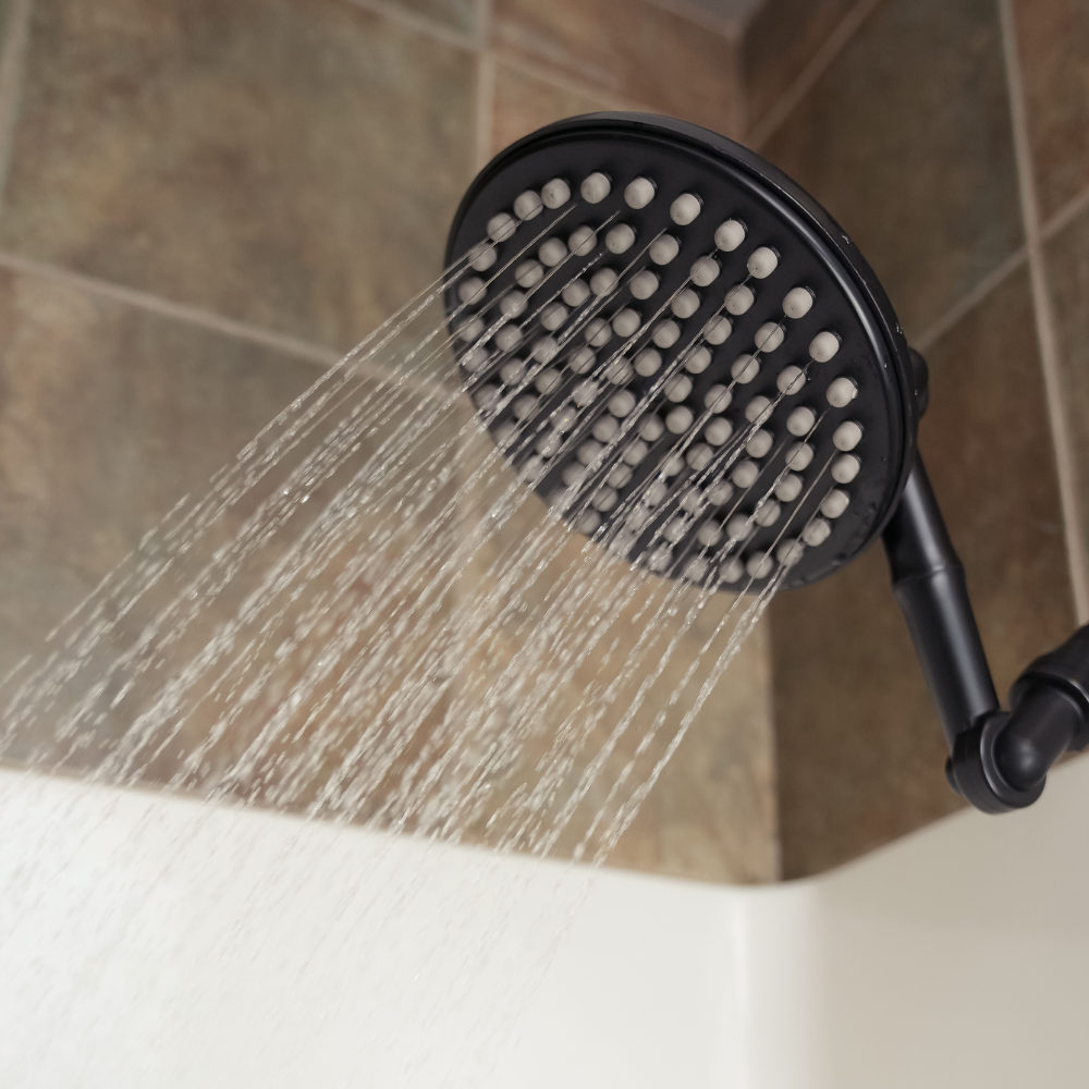 ShowerMe® Rain Shower Head in Matte Black spraying water