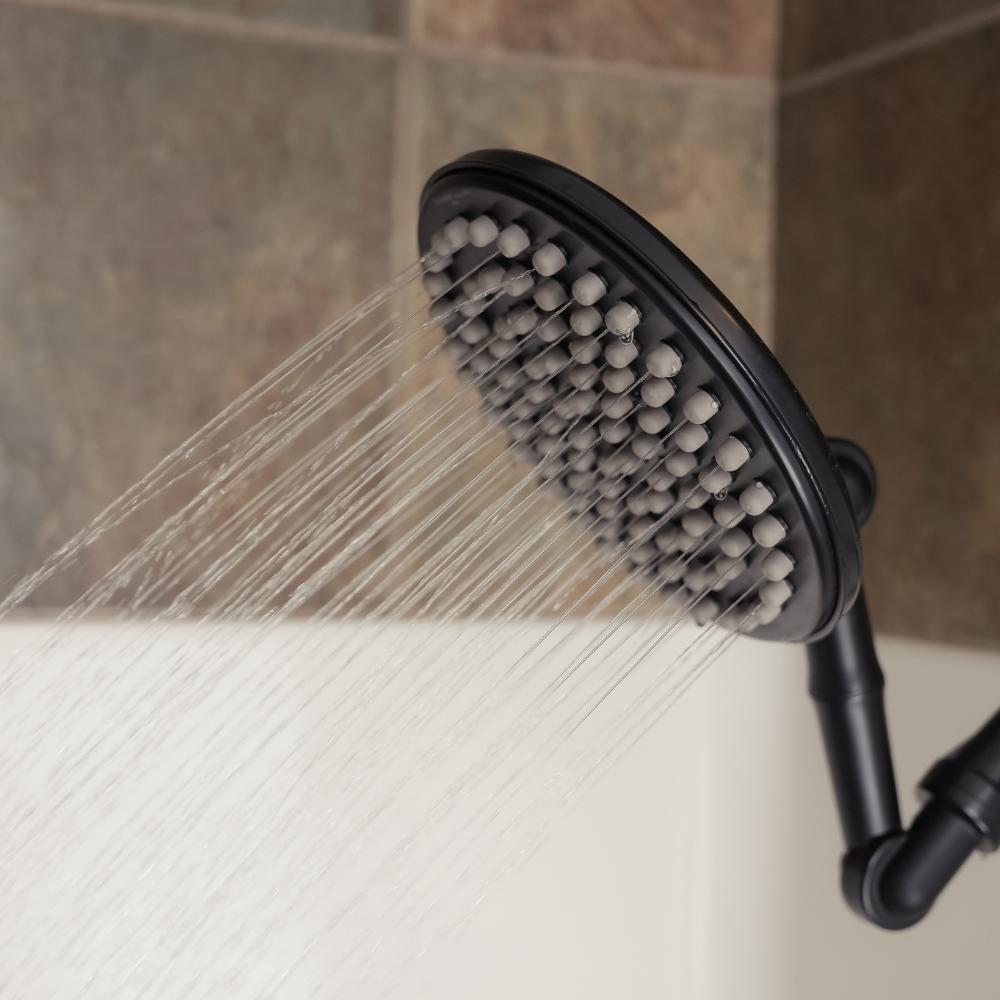 ShowerMe® Rain Shower Head in Matte Black spraying water in upright position