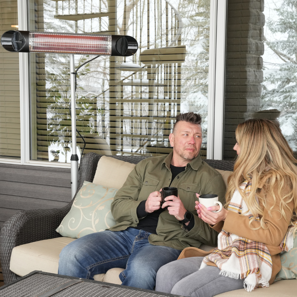 Couple enjoying a coffee while staying warm with the Veito Blade Heater