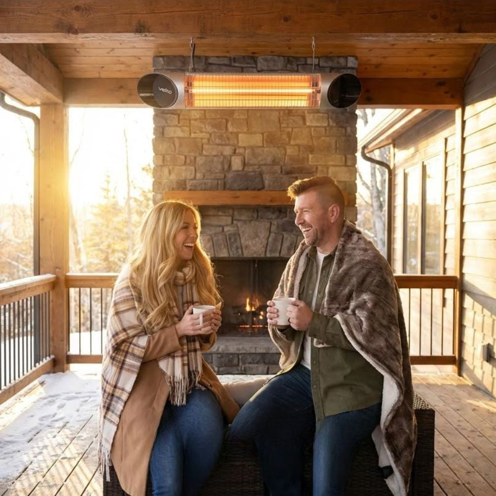 Couple enjoying a drink near a Veito Blade Heater that is mounted on the ceiling of a patio
