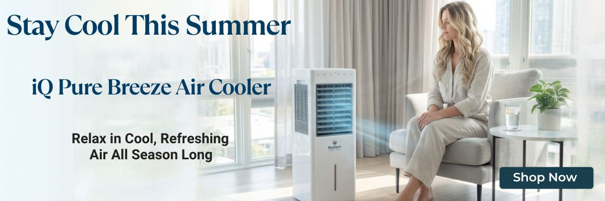 Woman staying cool at home with the iQ Pure Breeze Air Cooler