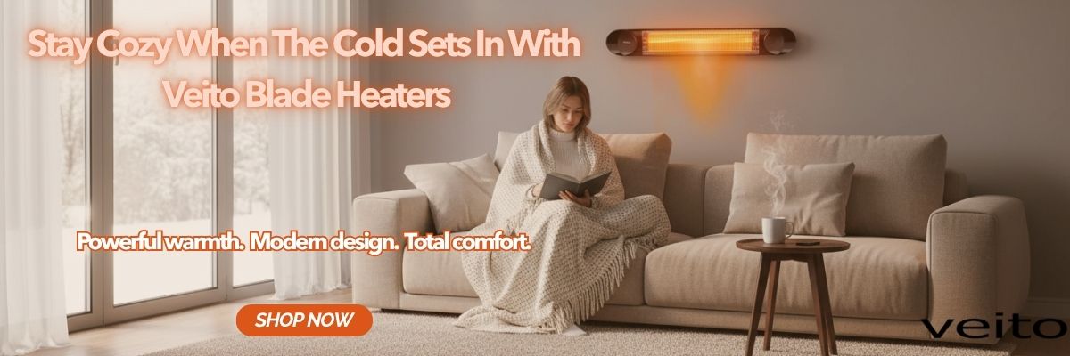 Woman reading a book and being kept warm by the Veito Heater mounted on the wall behind her