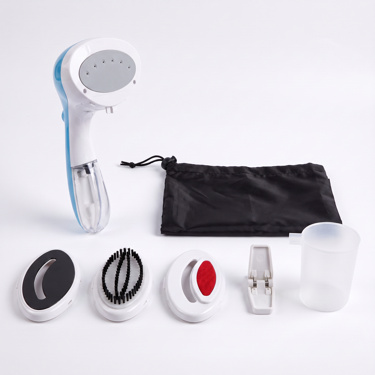 Eurosteam Steam Ezee with delicates plate, brush plate, lint remover plate, crease clip, measuring cup and travel bag